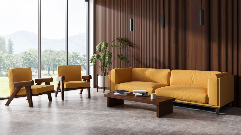 Ein fugenloser Boden in einem modernen Wohnzimmer mit gelber Sitzgarnitur